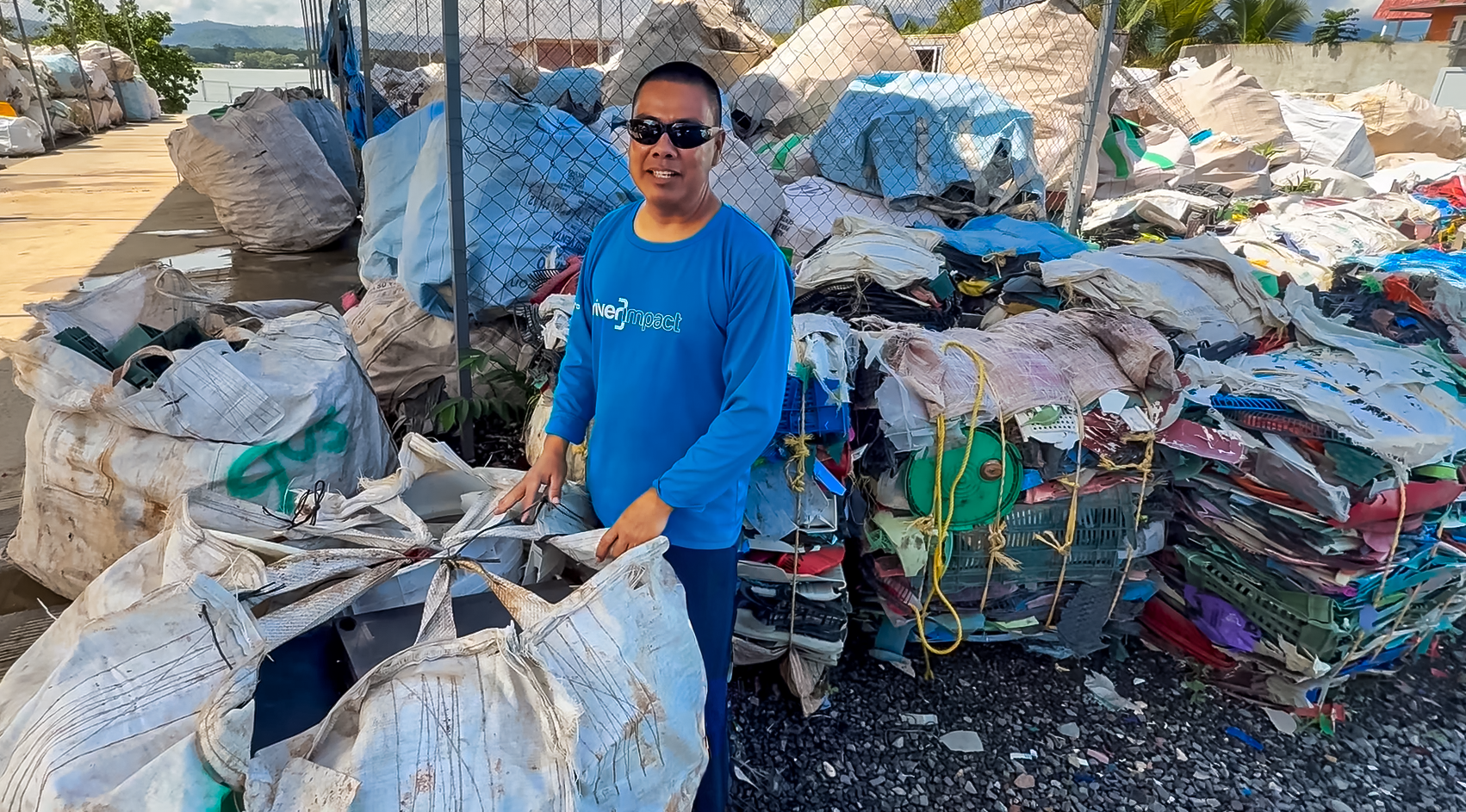 Community member sorting plastic collected from the river